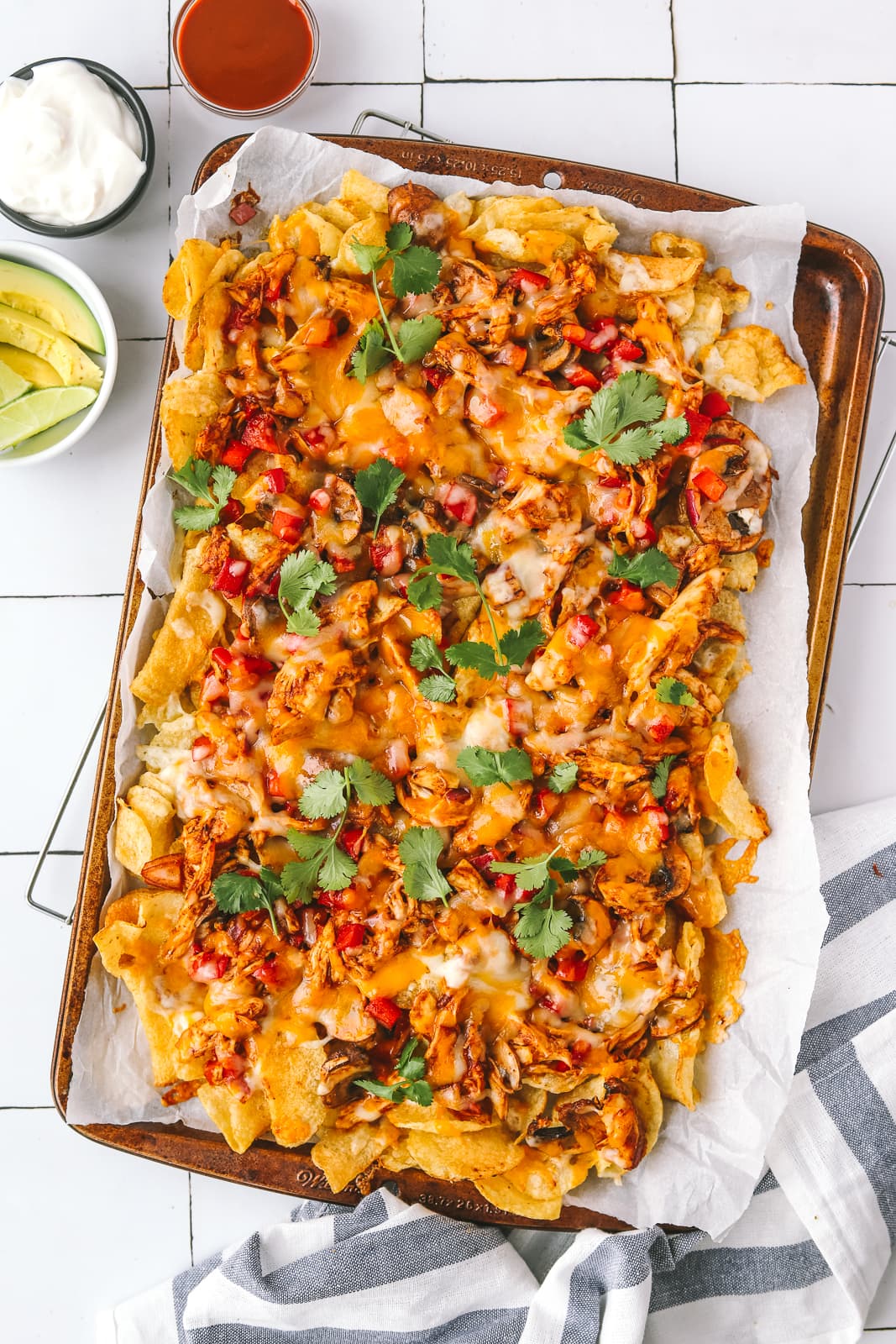 fully cooked bbq chicken nachos on a sheet pan