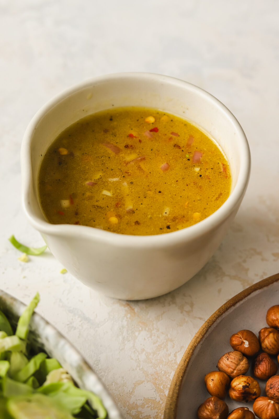 lemon shallot dressing in a cup