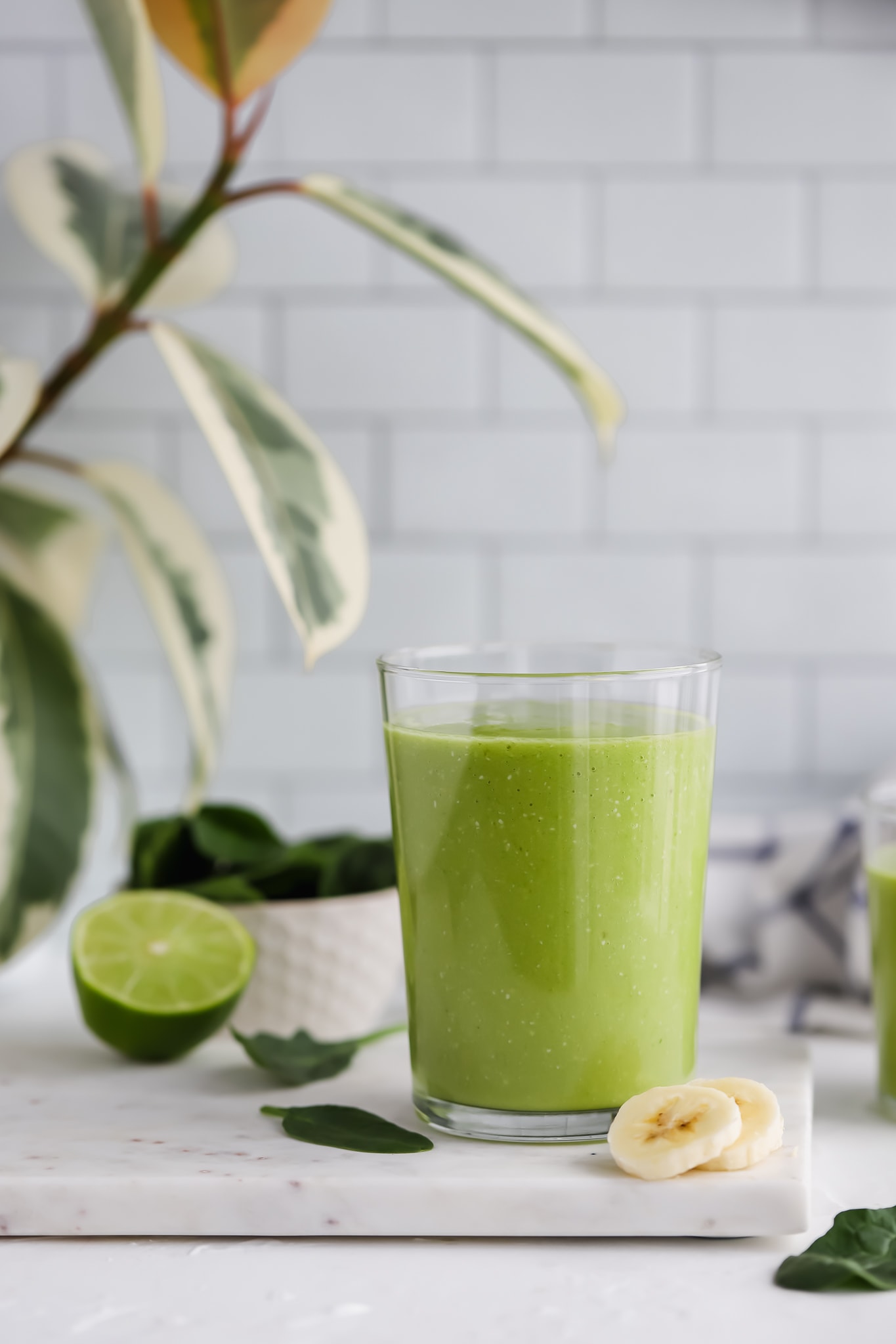 a cup full of green smoothie