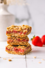 stack of strawberry bars with oat crumb