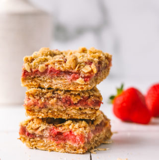stack of strawberry bars with oat crumb