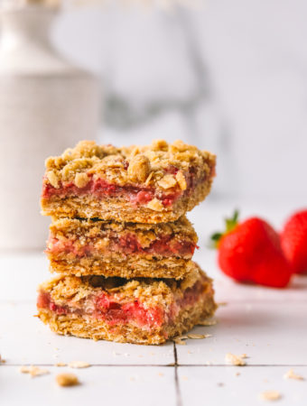 stack of strawberry bars with oat crumb