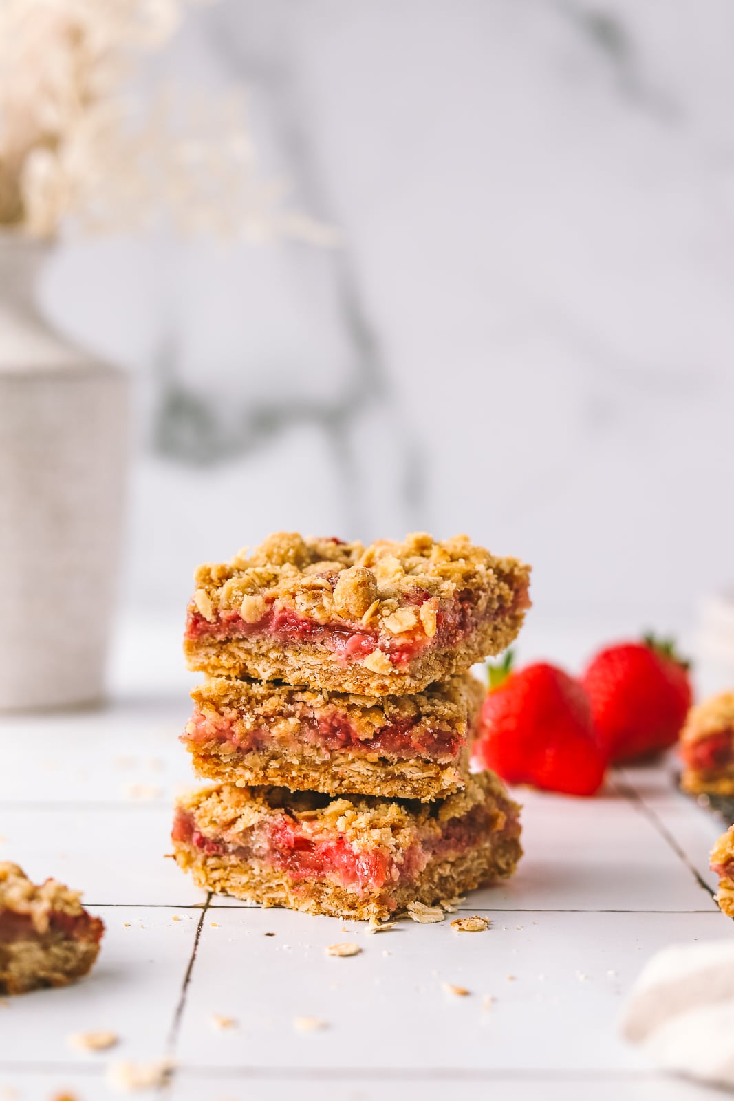 stack of strawberry bars with oat crumb