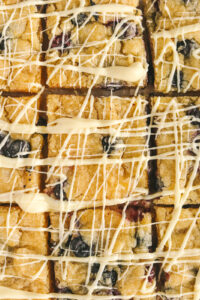 lemon blueberry dessert bar drizzled with white chocolate