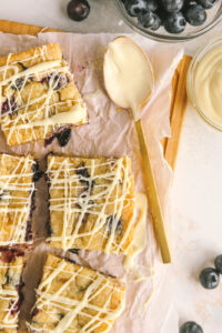 lemon blueberry dessert bar drizzled with white chocolate