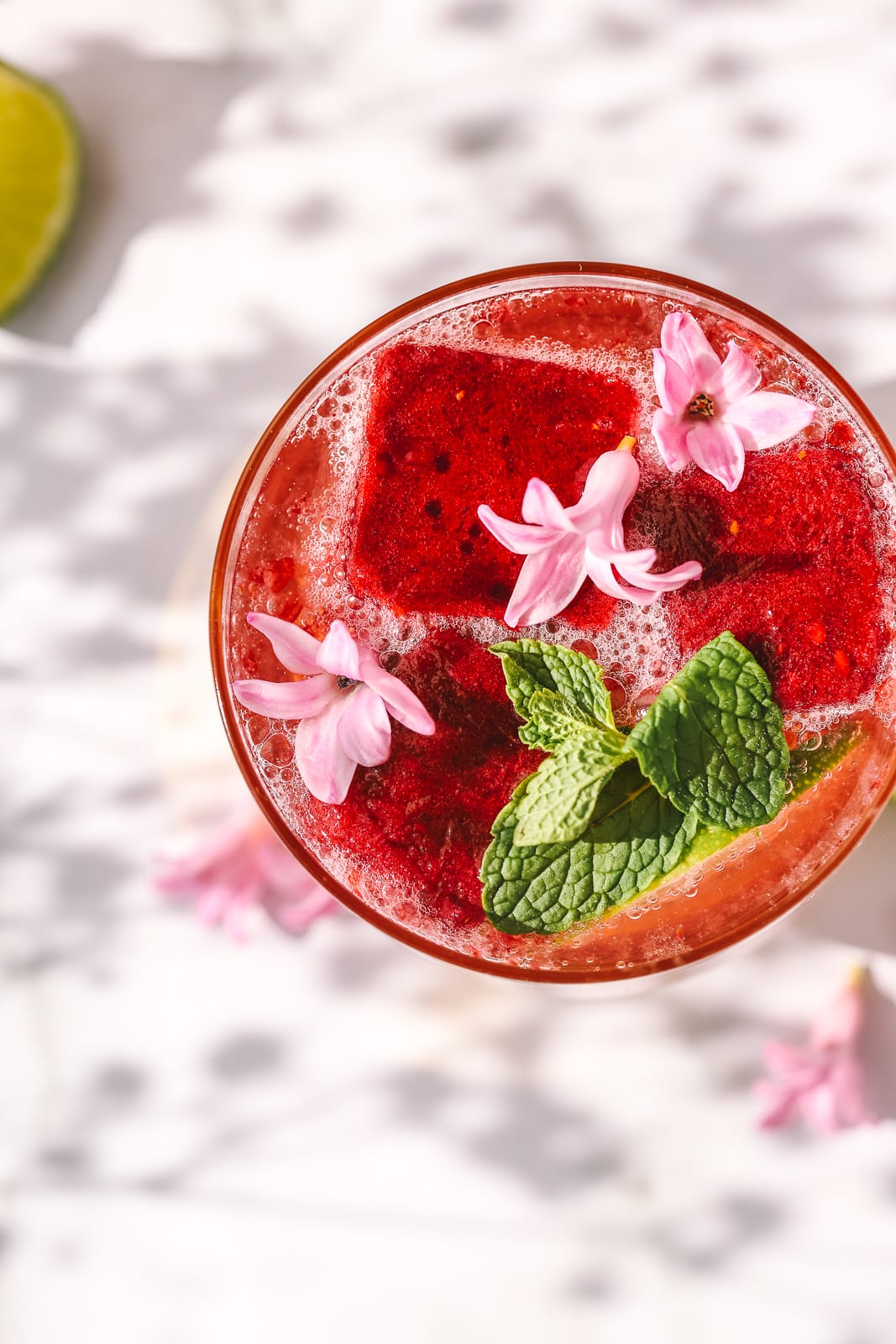 overhead shot of a blackberry cocktail in a glass