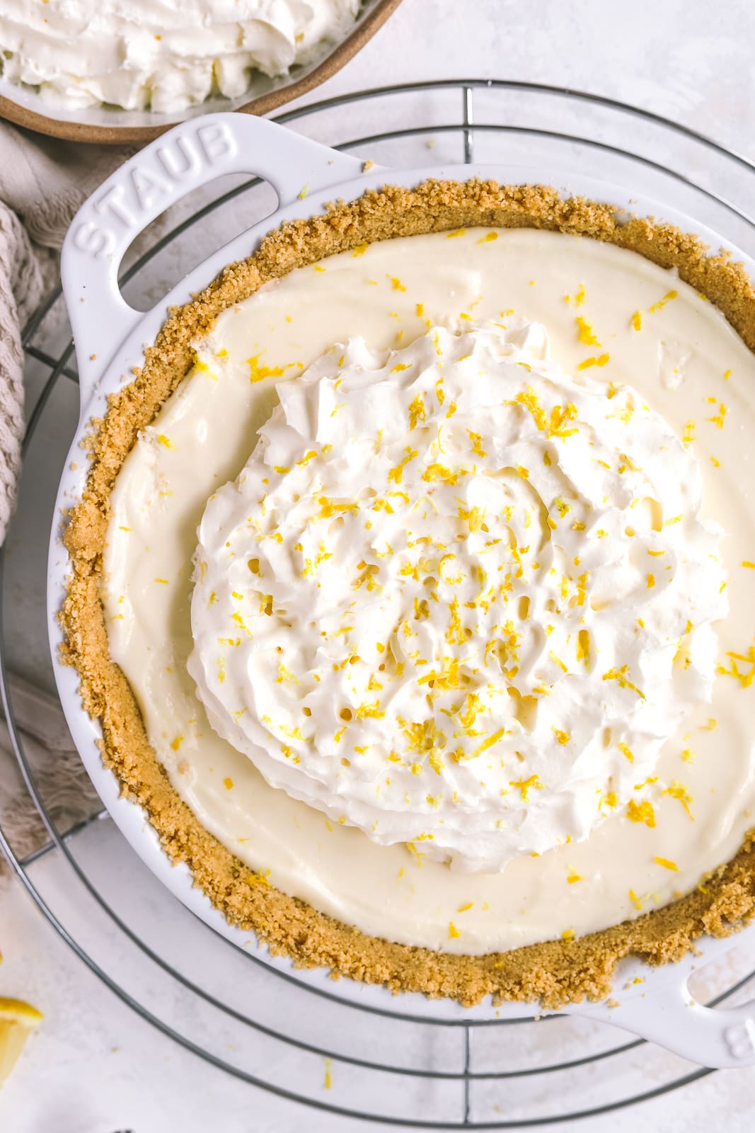 lemon icebox pie topped with whipped cream