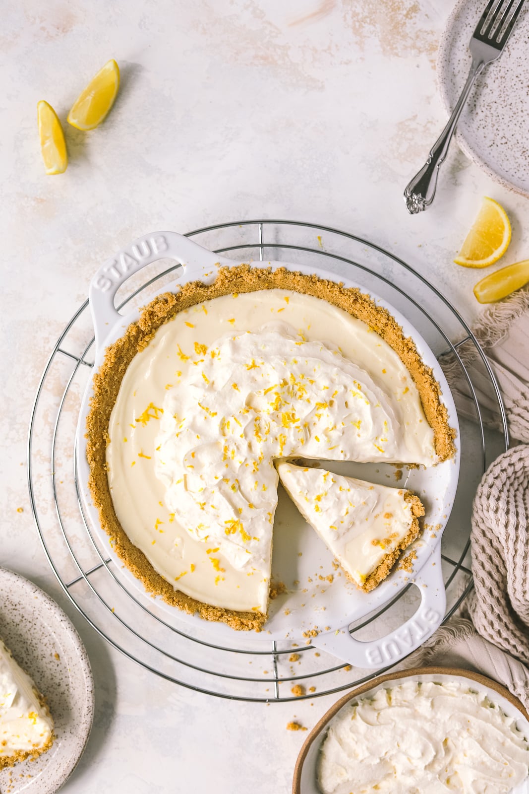 sliced of lemon pie topped with whipped cream