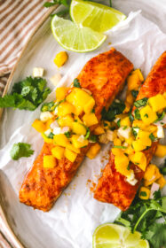 Easy Chili Lime Baked Salmon with Mango Salsa closeup of chili lime baked salmon on a tray