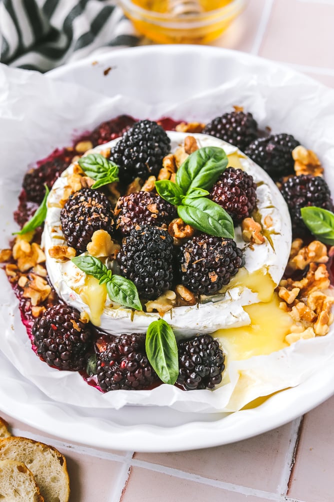 side angle of blackberry baked brie with walnuts