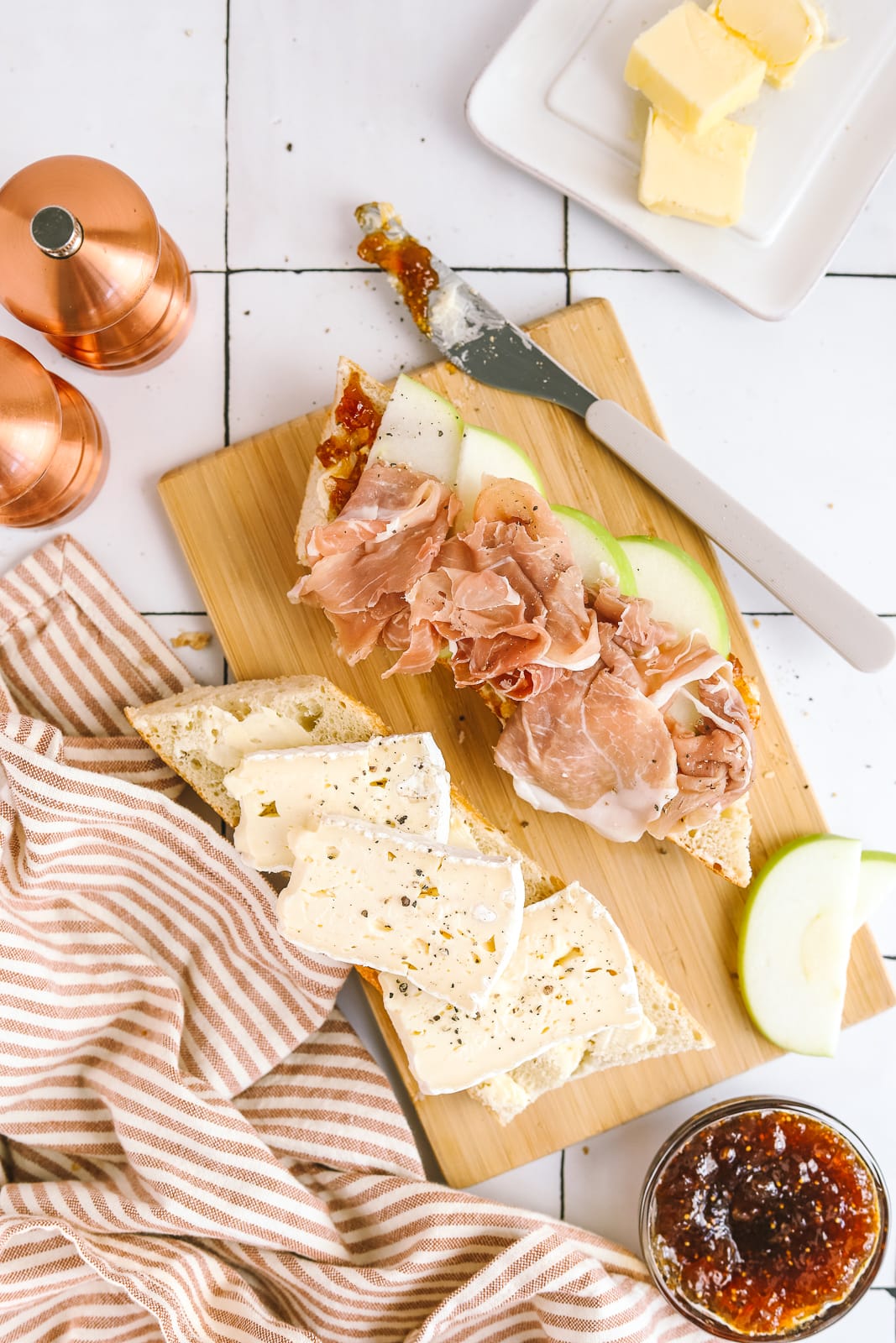 brie sandwich being made on a cutting board