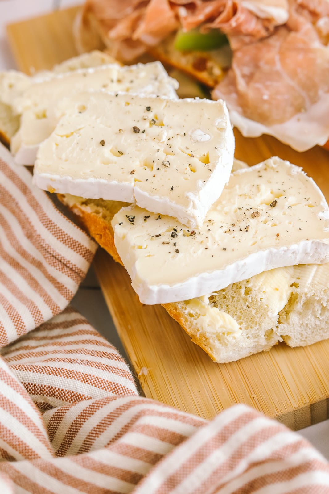 brie cheese stacked on a baguette