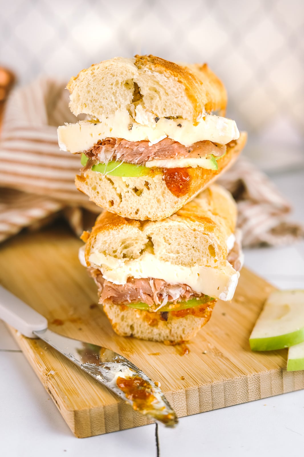 brie sandwich stacked on a cutting board