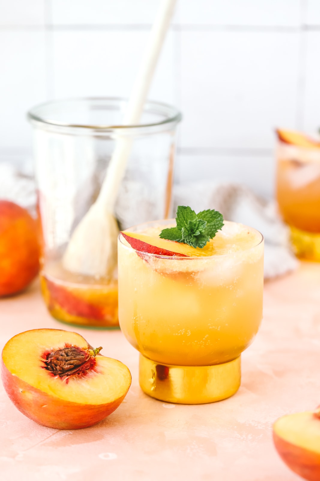 peach whiskey cocktail in a cocktail glass