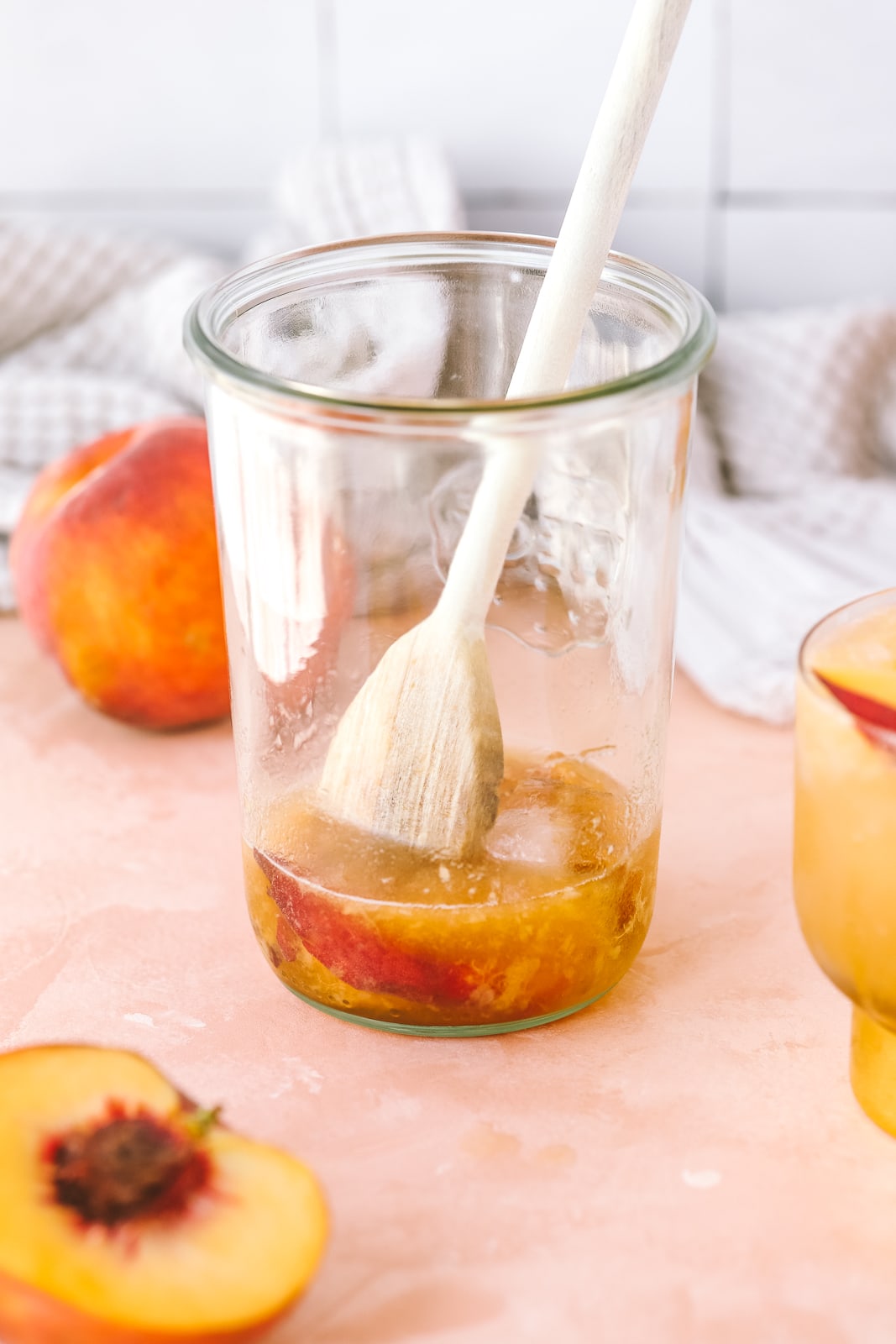 peaches smashed for a cocktail