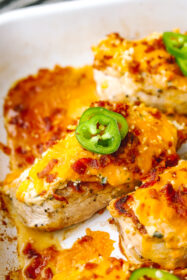 The Best-Ever Baked Jalapeno Popper Chicken Recipe angled shot of baked jalapeno popper chicken