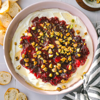 cranberry whipped feta dip in a pink bowl