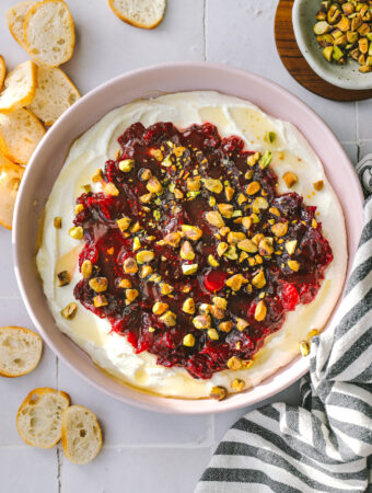 cranberry whipped feta dip in a pink bowl