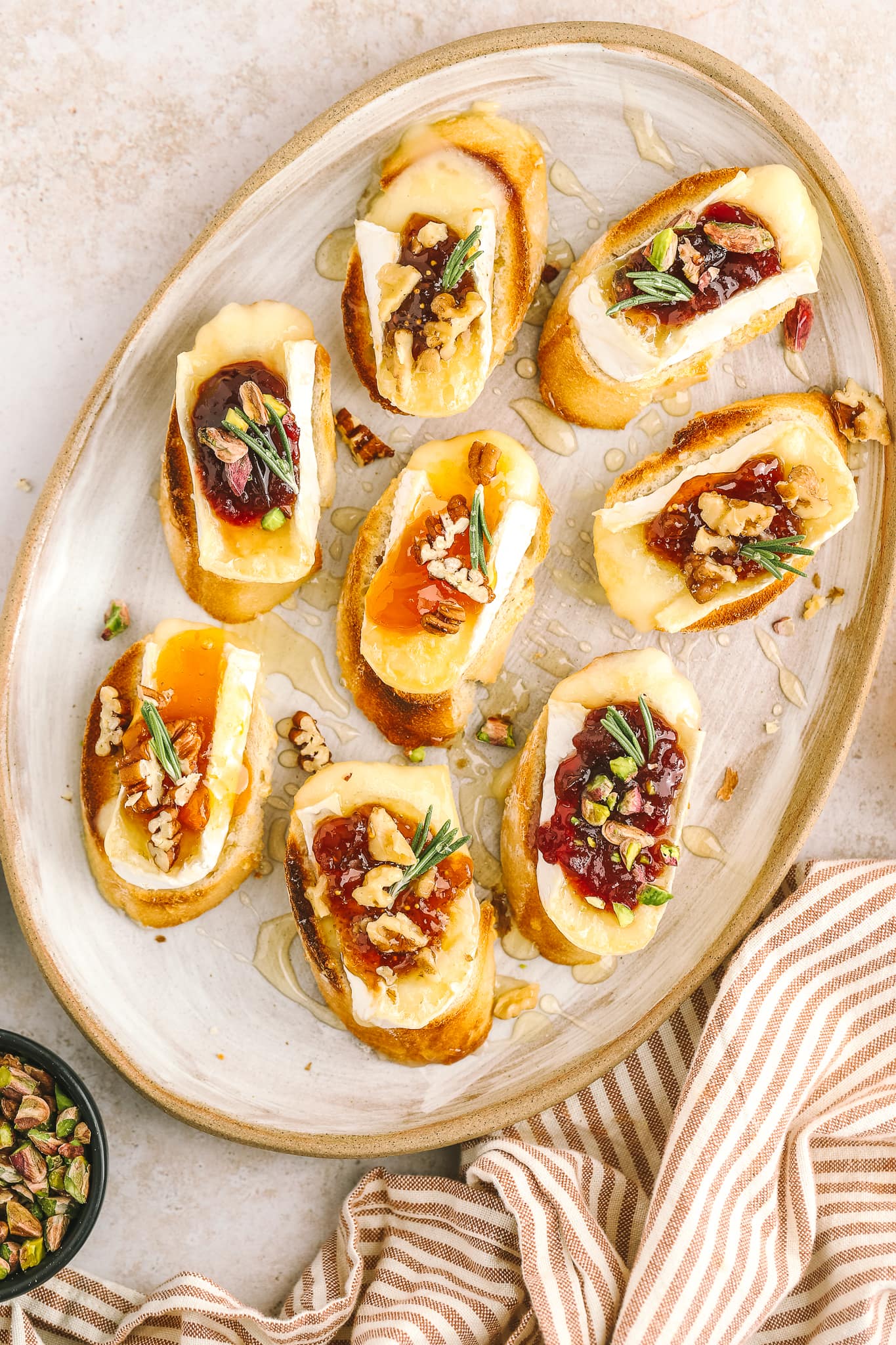 overhead of brie crostini on serving tray