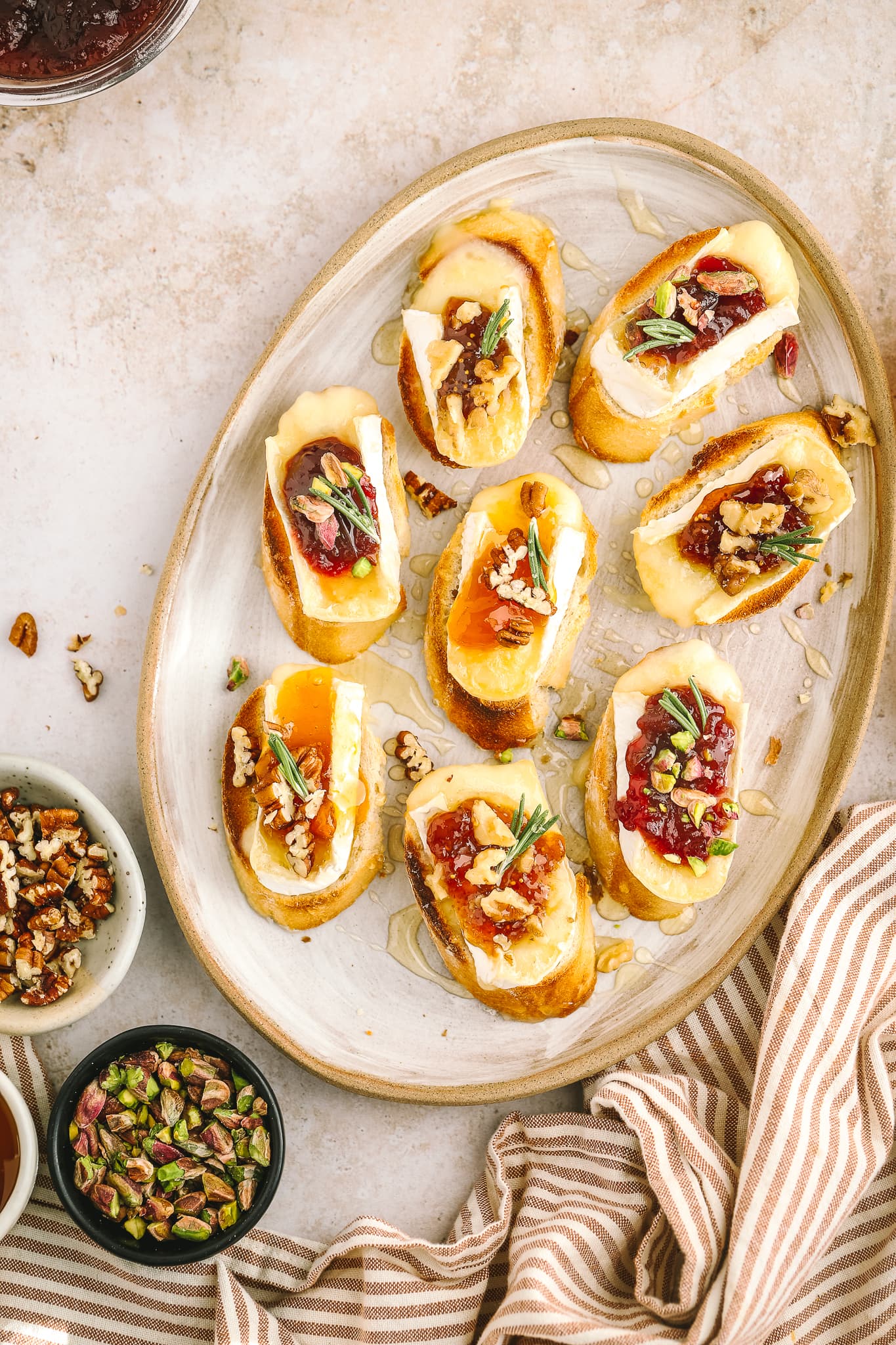 overhead of brie crostini on serving tray