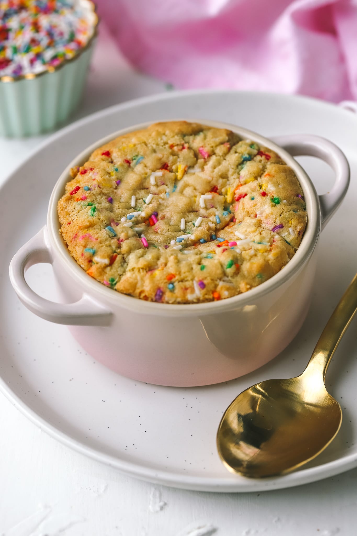 side angle of baked single serving sugar cookie in a ramekin