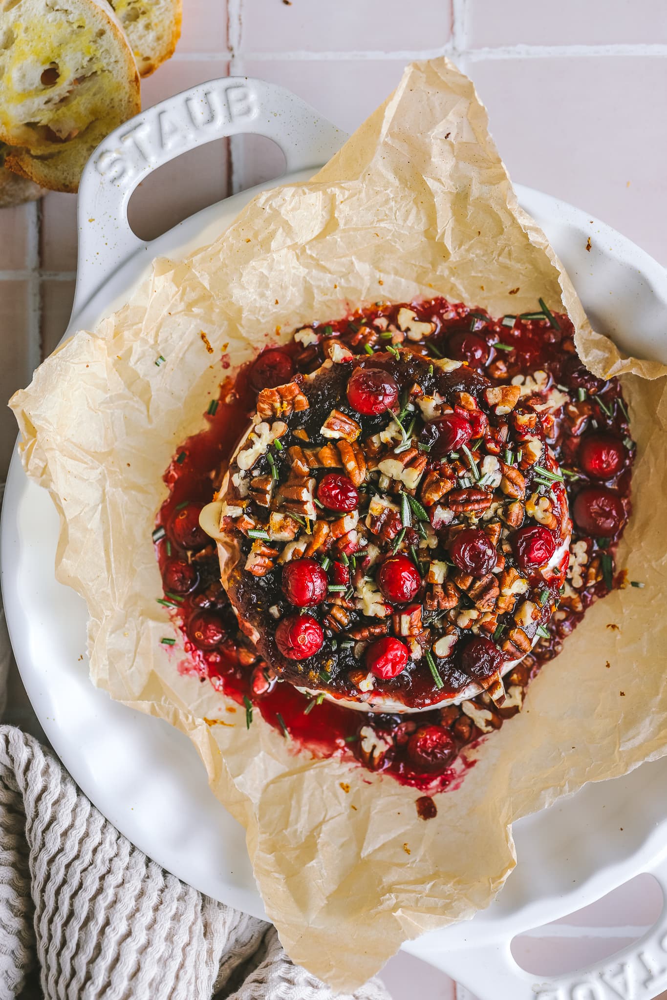 overhead shot of baked brie in a baking dish