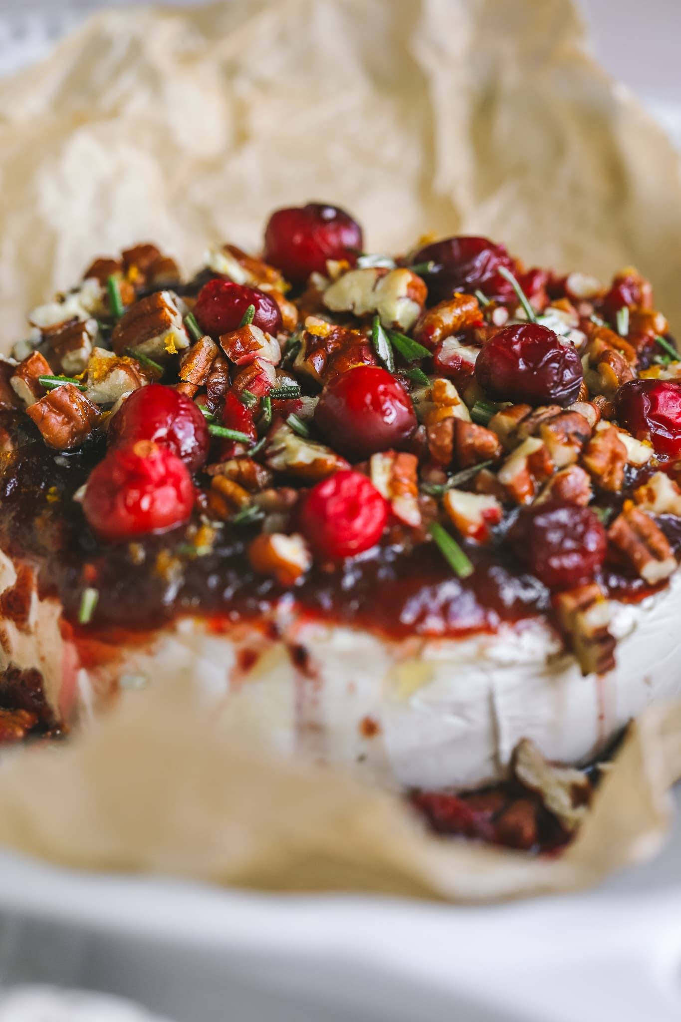 closeup of cranberry baked brie in a serving dish