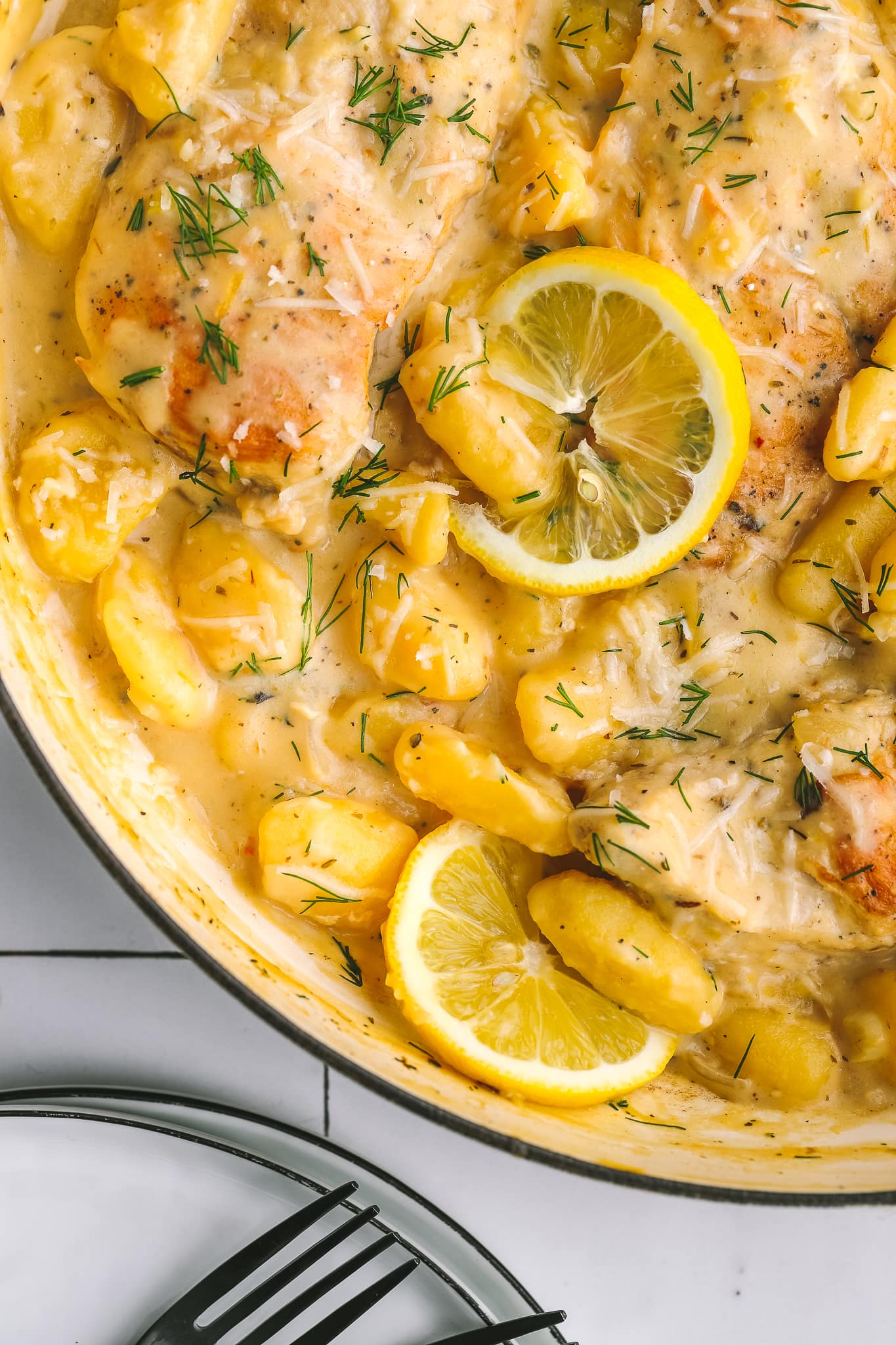 closeup of cooked gnocchi in the corner of one pan