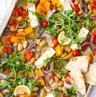 overhead photo of sheet pan dinner with feta and vegetables