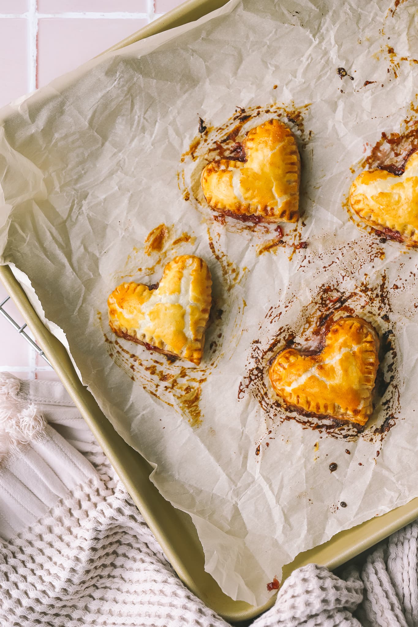 baked raspberry jam filled puff pastry heart pies 