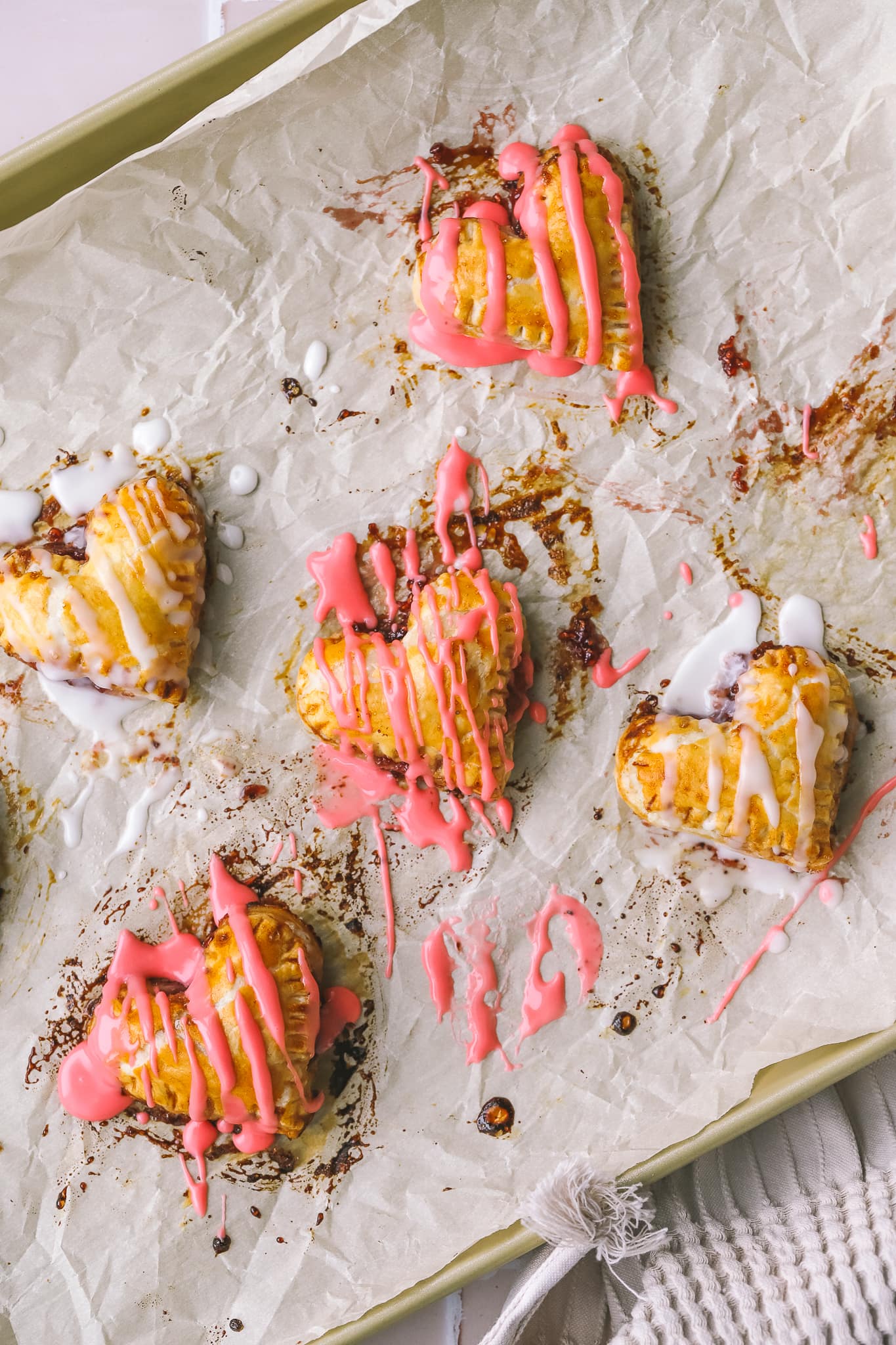 puff pastry hearts drizzled with pink icing