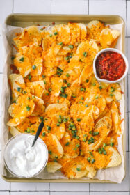 sheet pan of cheesy baked jalapeno ranch chips with dips