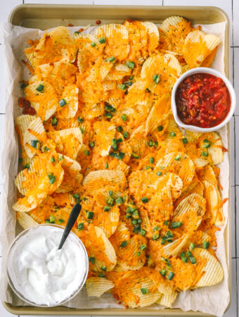 sheet pan of cheesy baked jalapeno ranch chips with dips