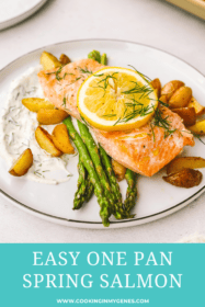 salmon on a plate with asparagus, potatoes and dill sauce