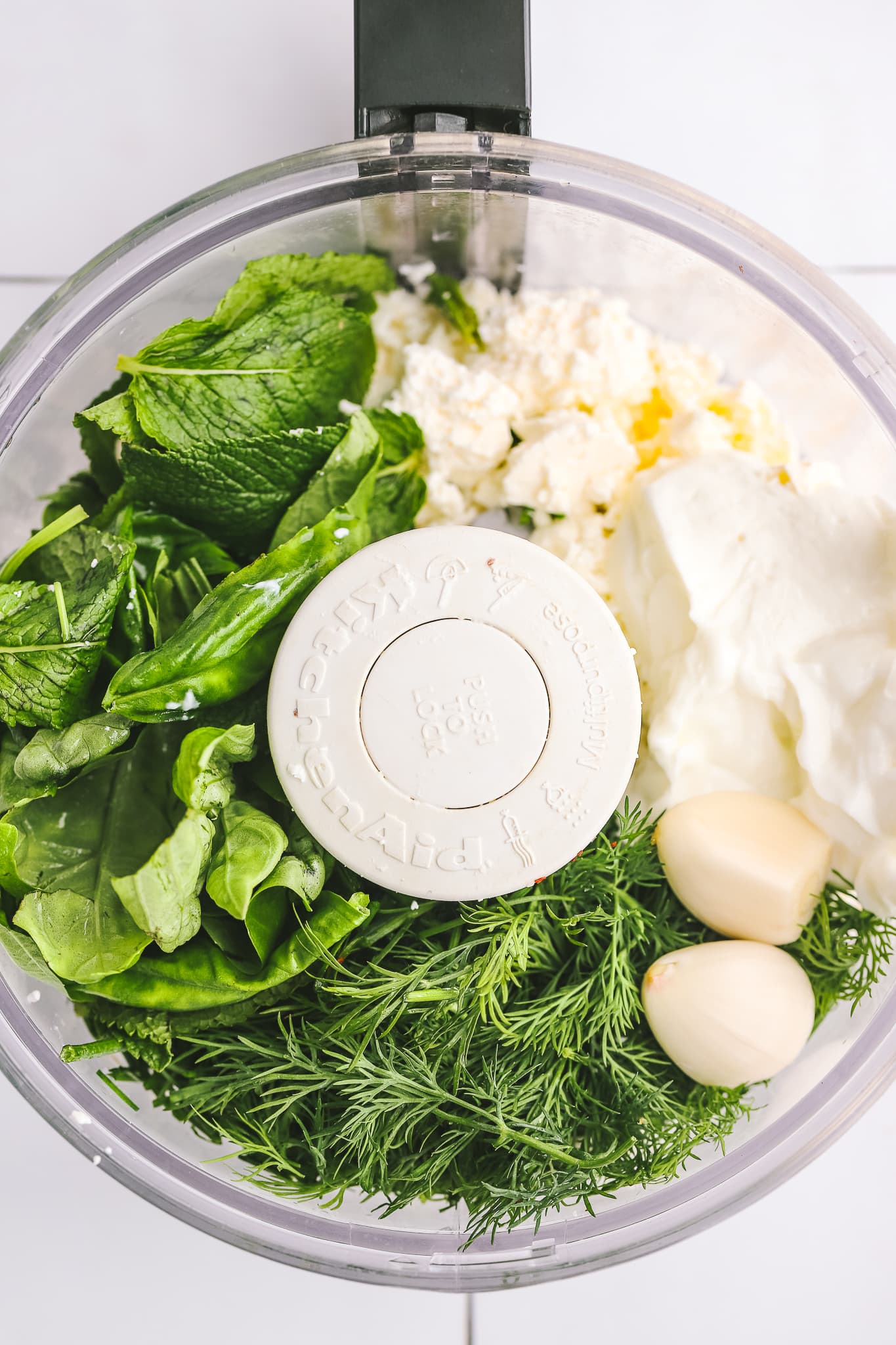 herbs, yogurt, feta in a food processor