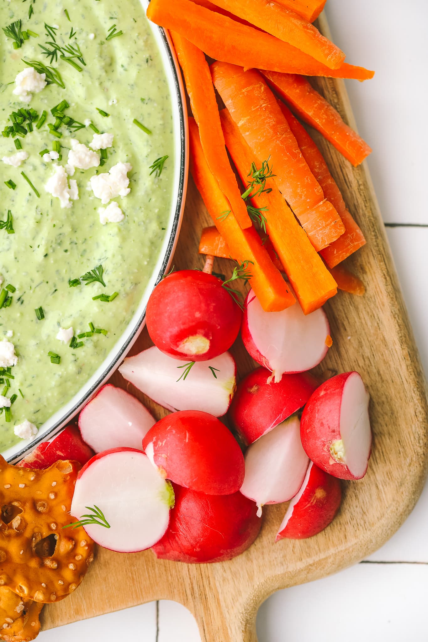 closeup of cut radishes and carrots