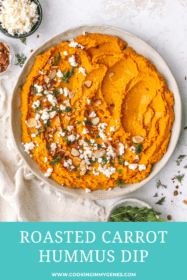 carrot hummus spread in a low bowl with toppings