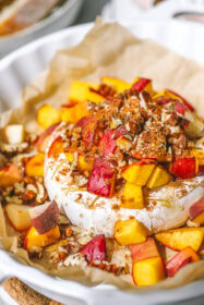 Easy Peach & Pecan Baked Brie (summer appetizer) close up of peach pecan baked brie