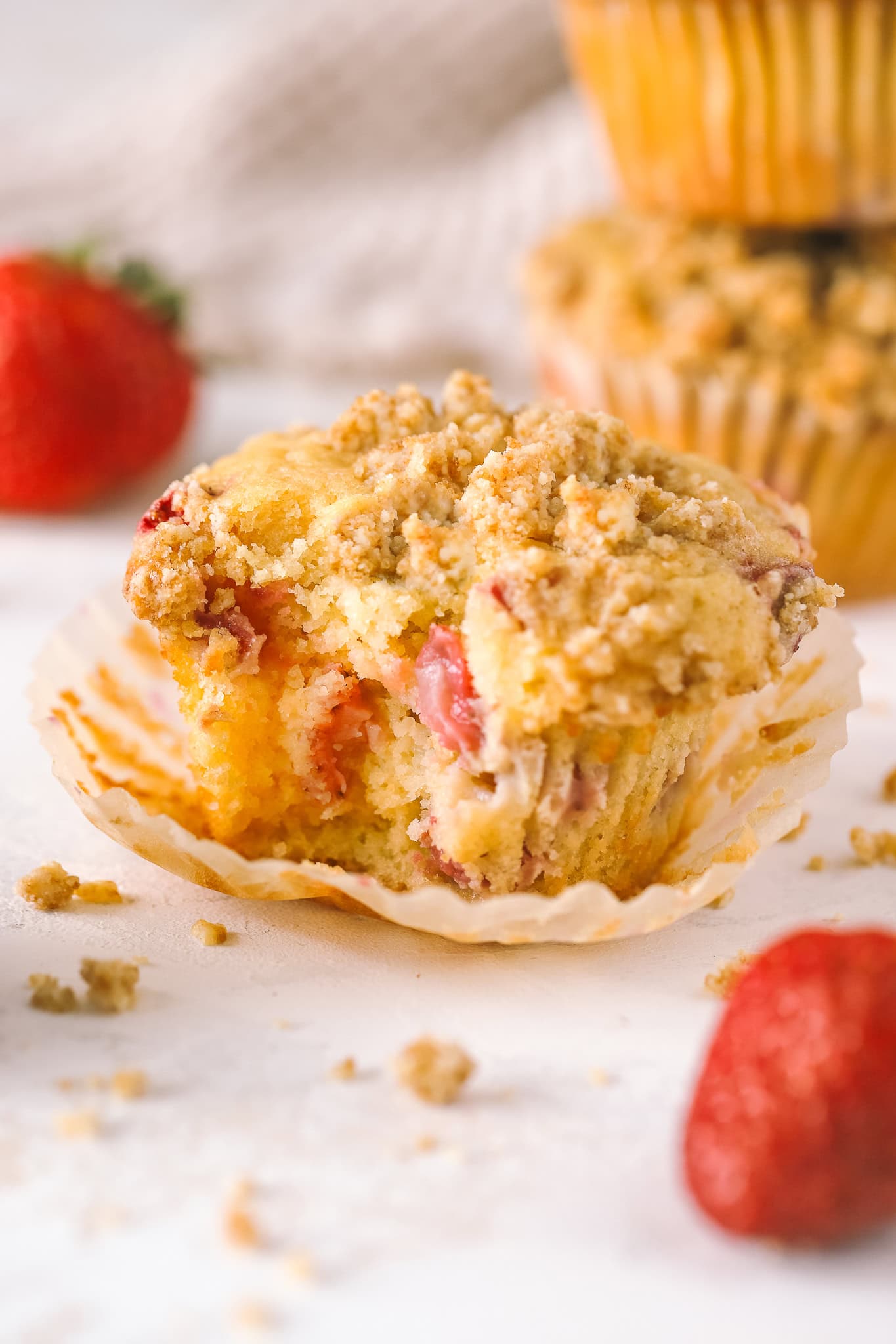 strawberry rhubarb muffin with bite taken out