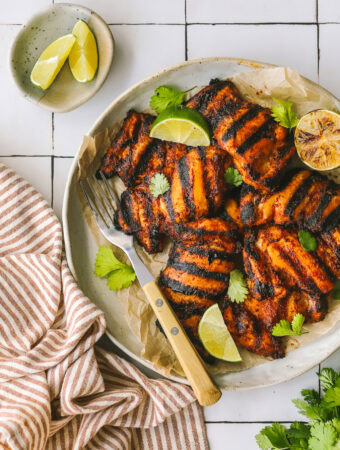 chili lime chicken thighs on a serving platter
