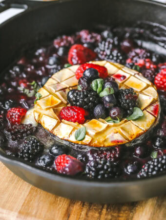 side angle brie in a pan topped with berries