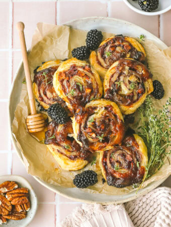 blackberry puff pastry pinwheels on a plate