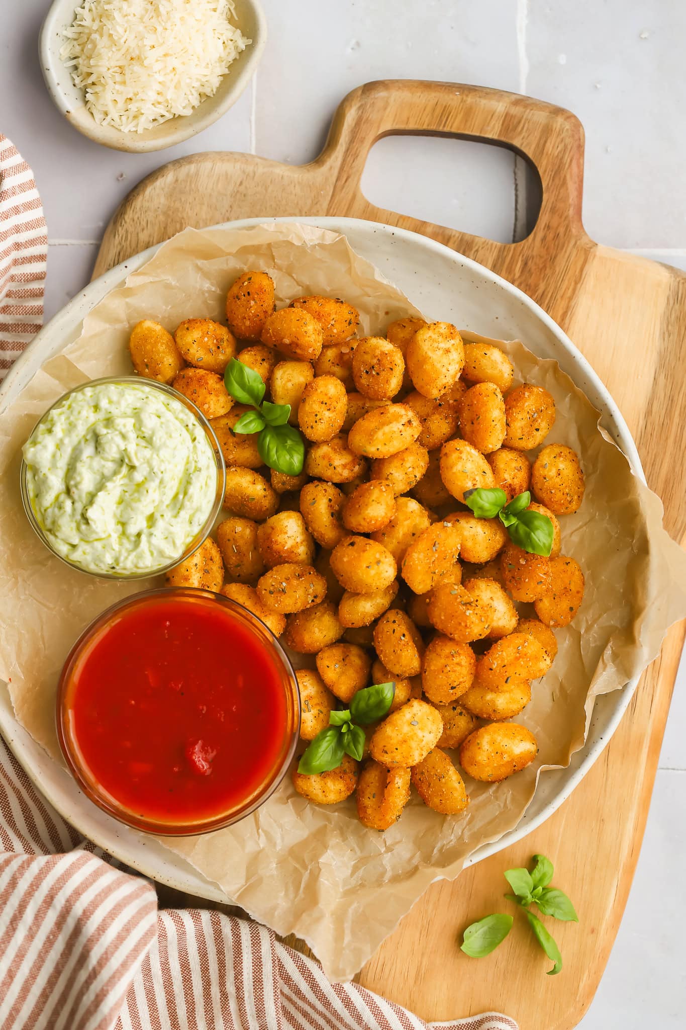 air fryer gnocchi on a plate with two dipping sauces
