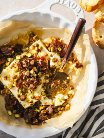 baked feta with a serving knife