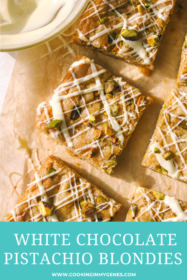 white chocolate pistachio blondies on parchment paper with icing