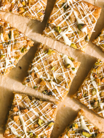 white chocolate pistachio blondies on parchment paper