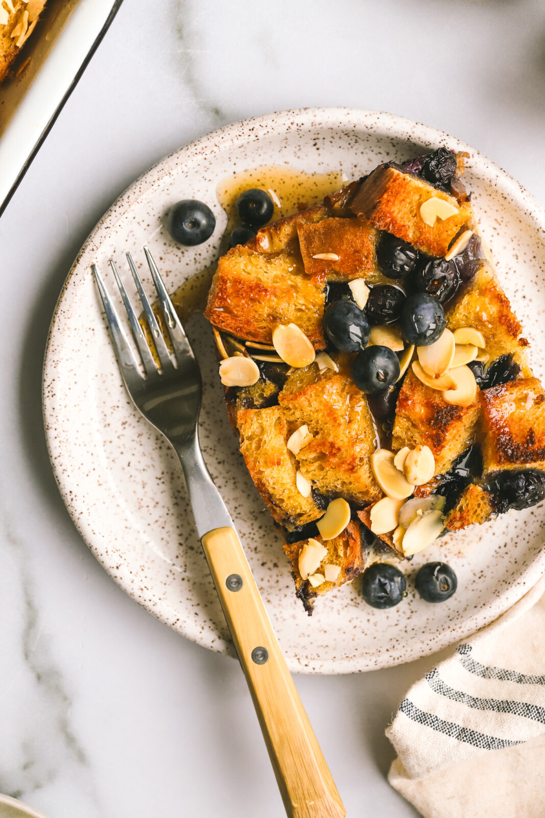 close-up of a piece of blueberry breakfast bake on a plate