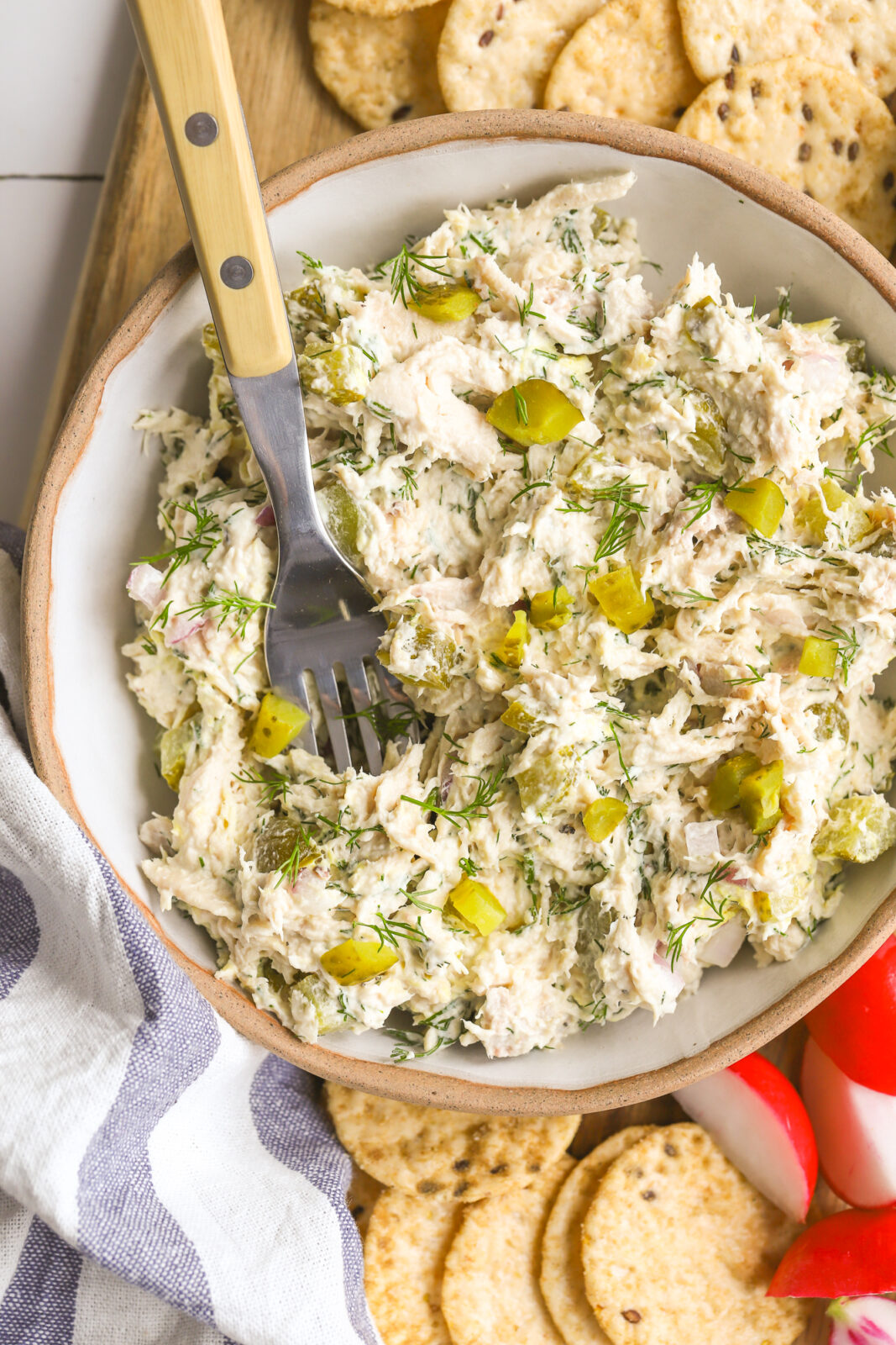spoon in a bowl of chicken salad