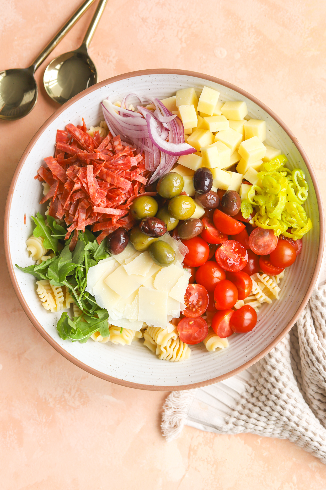 summer pasta salad ingredients in a bowl