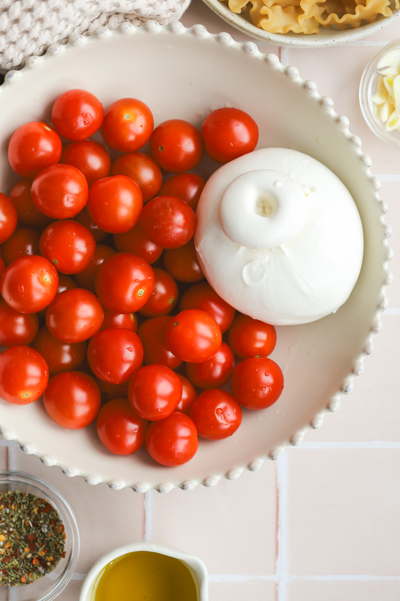 tomatoes and burrata cheese in a bowl